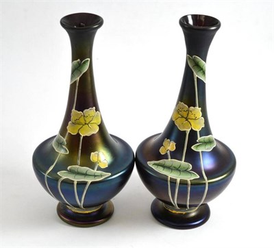 Lot 74 - A pair of Austrian iridescent vases, painted with lily pads, signed WH XIII 12, 25cm