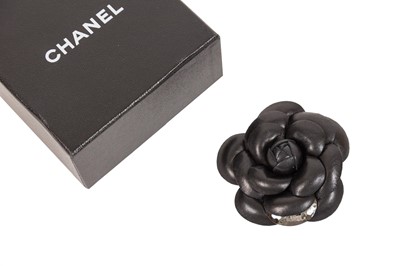 Lot 3005 - A Black Leather Camélia Brooch, by Chanel,...