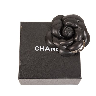 Lot 3005 - A Black Leather Camélia Brooch, by Chanel,...