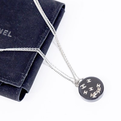 Lot 3023 - A Black Resin Pendant on Chain, by Chanel, the...