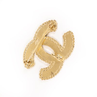 Lot 3009 - An Enamel and Paste Brooch, by Chanel, two...