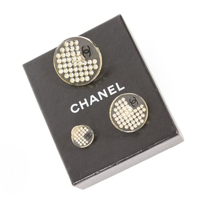 Lot 3026 - Three Resin Pin Brooches, by Chanel, the...