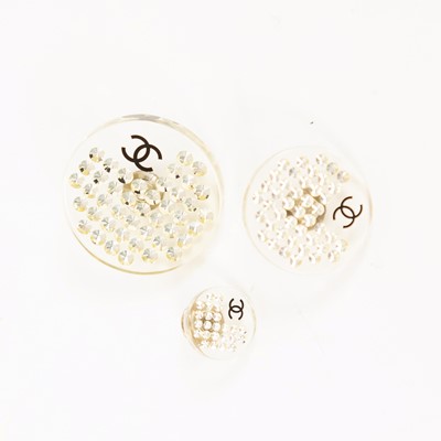 Lot 3026 - Three Resin Pin Brooches, by Chanel, the...