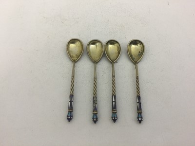 Lot 2059 - A Set of Four Russian Silver and Enamel Spoons,...