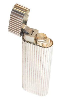 Lot 100 - A Cartier silver plated lighter, decorated...