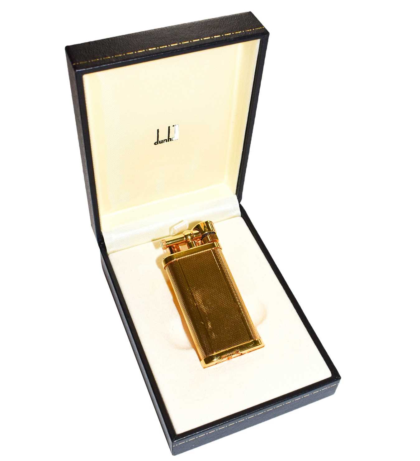 Lot 89 - A Dunhill gold plated lighter with engine...