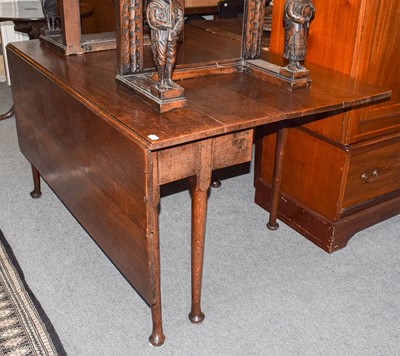 Lot 464 - An early 19th century oak gateleg dining table,...
