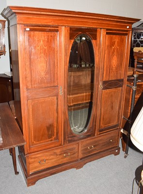 Lot 1203 - An Edwardian inlaid mahogany mirrored wardrobe,...