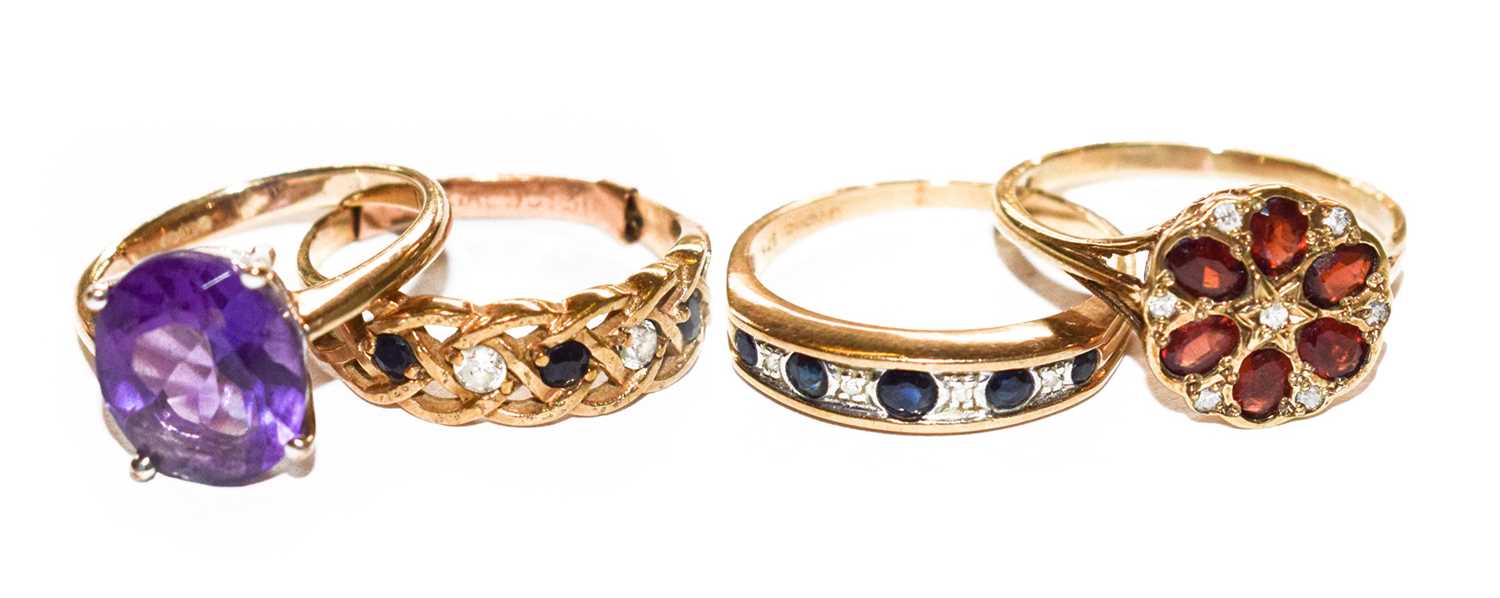 Lot 139 - Four 9 carat gold gem set rings, including a...