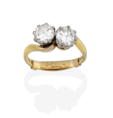 Lot 2341 - An 18 Carat Gold Diamond Two Stone Twist Ring,...