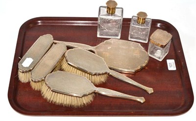 Lot 101 - An Asprey & Co silver gilt mounted eight piece dressing table set comprising three etched glass...