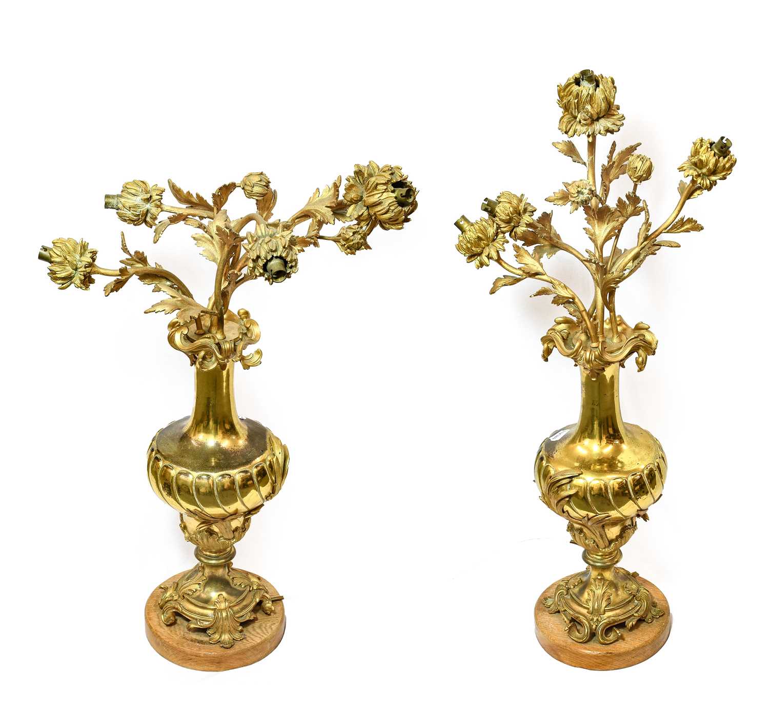 Lot 1050 - A Pair of Gilt Metal Four-Light Candelabra, in...