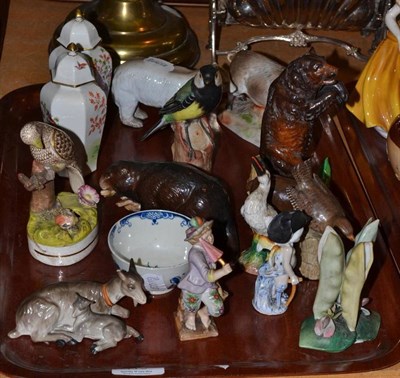 Lot 119 - An 18th century Worcester tea bowl, assorted Continental porcelain figures including a bear, an...