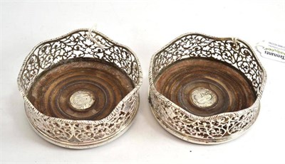 Lot 155 - A pair of silver coasters, marks worn, circa 1770