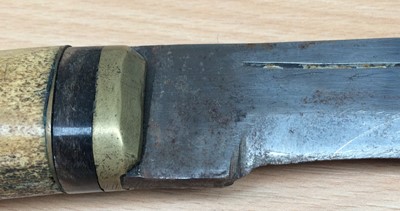 Lot 231 - A Kukri, the 35cm curved steel blade with...