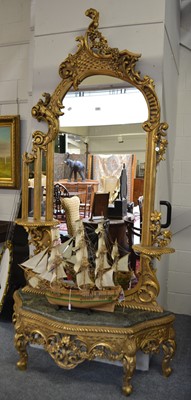 Lot 1100 - A Giltwood Pier Glass, modern, the arched...