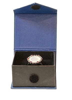 Lot 275 - A synthetic ruby, white stone and...