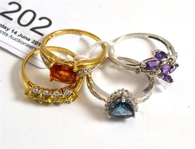 Lot 202 - Four 9ct gold rings set with diamonds and gemstones including amethyst, citrine etc