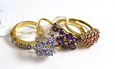 Lot 205 - Four 9ct gold rings set with diamonds and gemstones including amethyst, tanzanite etc