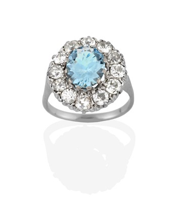 Lot 2365 - An Aquamarine and Diamond Cluster Ring, the...