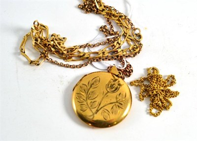 Lot 210 - A 9ct gold locket on a chain, a 9ct gold figaro chain and another chain