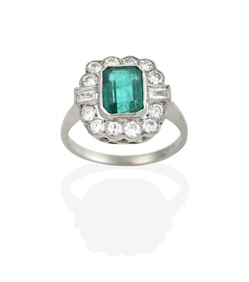 Lot 2340 - An Emerald and Diamond Cluster Ring, the...