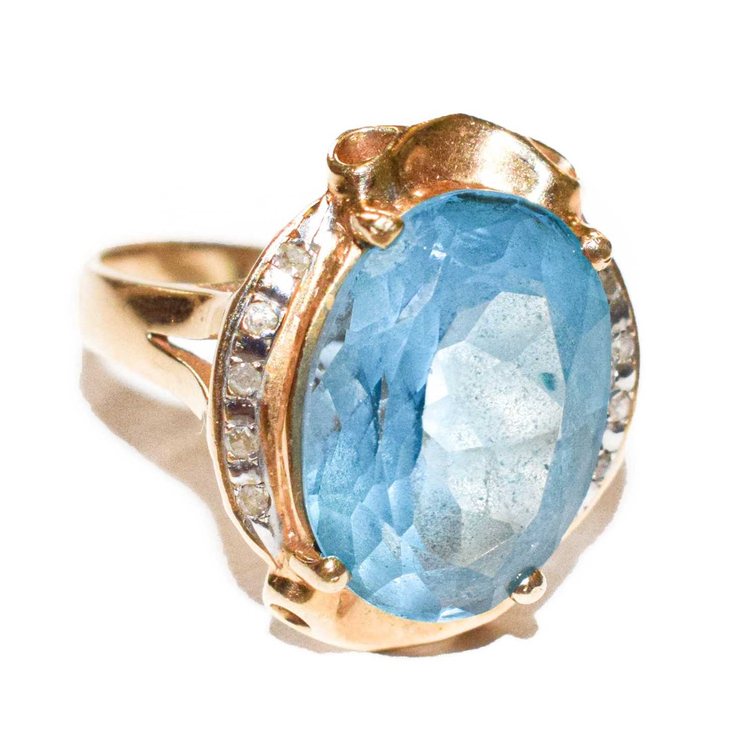 Lot 112 - A topaz and diamond ring, stamped '14K',...