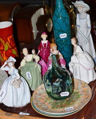 Lot 258 - Two Doulton ladies, Royal Worcester lady, two Coalport ladies and another and two Mdina glass vases