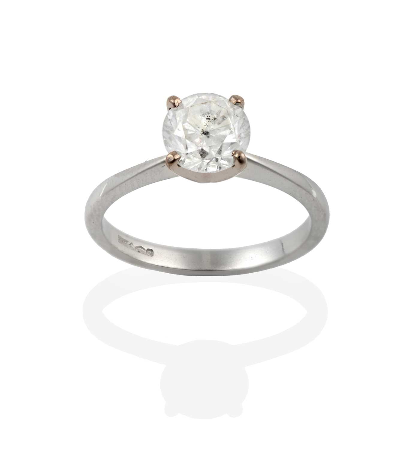 Lot 265 - A platinum diamond solitaire ring, the round...