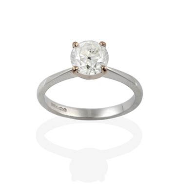 Lot A platinum diamond solitaire ring, the round...