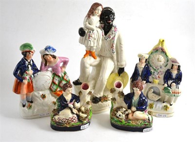 Lot 271 - Staffordshire figure 'Uncle Tom' and four other Staffordshire figures (5)