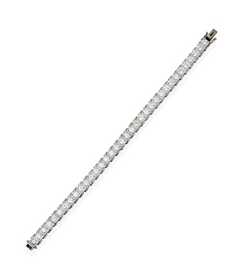 Lot 2358 - A Diamond Line Bracelet, round brilliant cut...