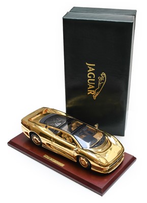 Lot 99 - Maisto 1:18 Scale Jaguar XJ220 gold in faux...