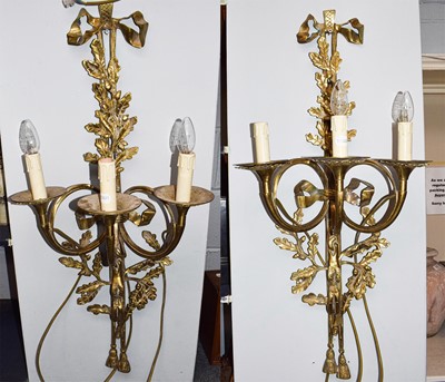 Lot 580 - A Pair of 20th century gilt brass three-light...