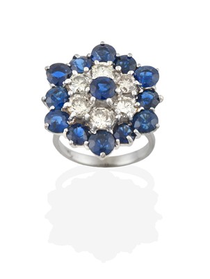 Lot 2376 - A Sapphire and Diamond Cluster Ring, a round...