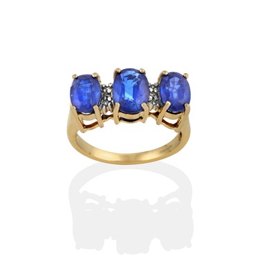 Lot 243 - A 9 carat gold sapphire and diamond ring, the...