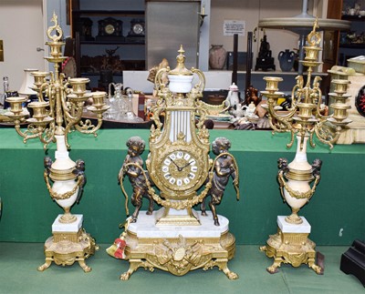 Lot 265 - A reproduction gilt metal and marble clock...