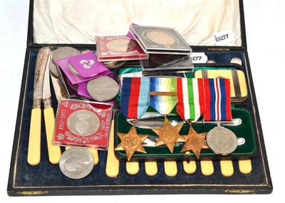 Lot 303 - A silver cigarette case, a set of World War II service medals with a France and Germany clasp,...