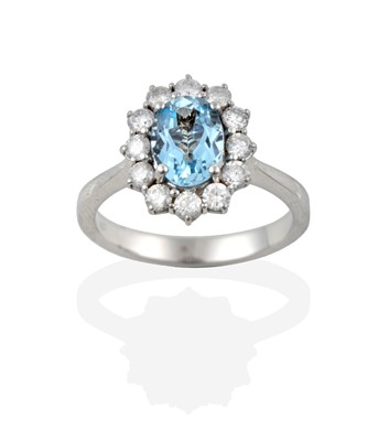 Lot 2364 - An Aquamarine and Diamond Cluster Ring, the...