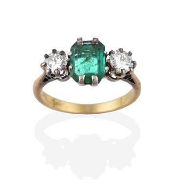 Lot 2278 - An Emerald and Diamond Three Stone Ring, the...