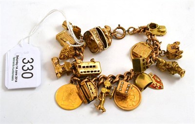 Lot 330 - A charm bracelet hung with nineteen charms, including a 1912 half sovereign and a 1913 half...