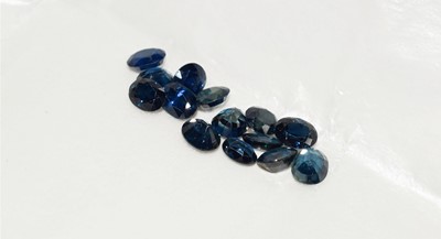Lot 145 - Fourteen loose oval cut sapphires, totalling...