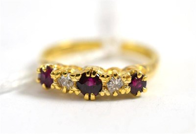 Lot 340 - An 18ct gold ruby and diamond five stone ring