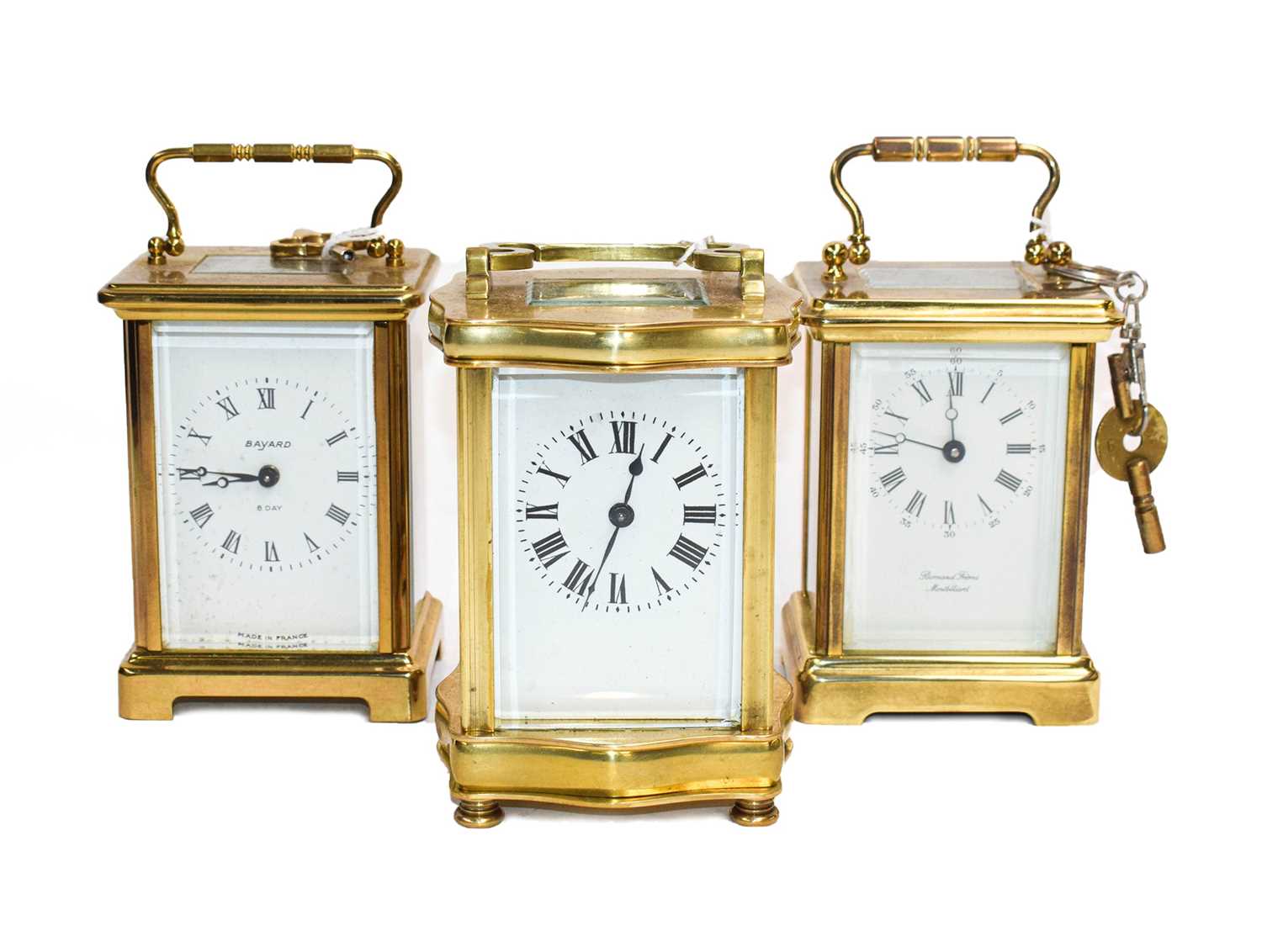Lot 59 - A brass carriage timepiece, circa 1900 and two...
