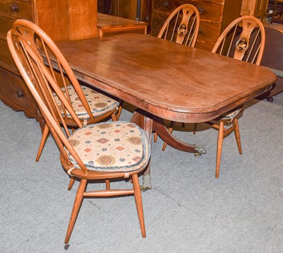 Lot 476 - A set of four Ercol elm swan back chairs