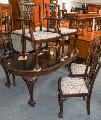 Lot 530 - An early 20th century mahogany wind out dining...