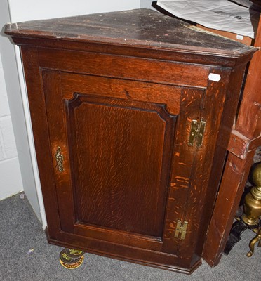 Lot 462 - A George III oak panelled hanging corner...