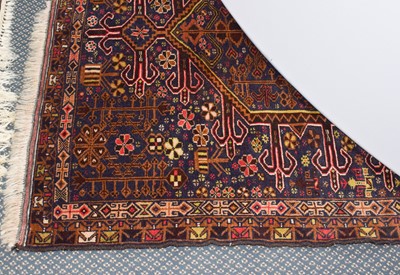 Lot 343 - Baluch rug, the lozenge field with geometric...