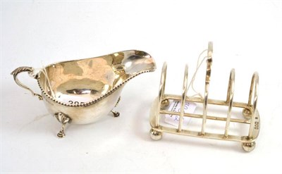 Lot 385 - Walker & Hall silver sauce boat and a five bar silver toast rack (2)