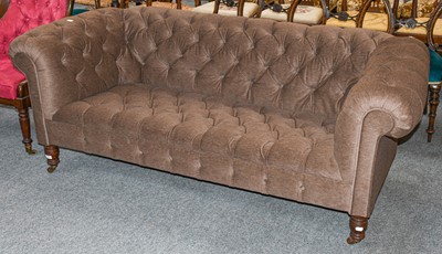 Lot 498 - A brown upholstered Chesterfield style sofa